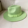 Breda brim hattar kvinnor klassisk fedora hatt med båge män kände panam panama jazz elegant trilby cap grossist