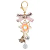 XDPQQ Kreativ Ny Rhinestone Pearl Camellia Alloy Keychain Bow Flower Couple Pendant G1019