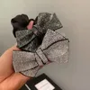 Мода Black Bowknot Дамба для волос Горный Хрусталь Блестящий Лук Большой кишечник Художник Резина Резина Женщина Волос