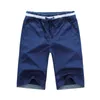 夏のソリッドカラーカジュアルショーツ男性ファッションルーズビーチパンツの綿の大きいサイズオーバーオールM-4XL 210713