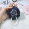 Kreki Koreańskie kreatywne kamelię futra piłka brelokowa Perła Bag łańcuchowa wisiewana żeńska Pluszowa Kluczowy pierścień akcesorium miRI22