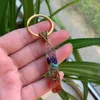 7 Chakra orgon Pendulum nyckelringar Energi Kristallsten Keychain Healing Amulet nyckelringar för bil meditation Reiki om lycklig gåva