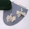 Stud Corée Super Fée Violet Beige Fil Dentelle Arc Perle Boucles D'oreilles Fille Douce Oreille Femmes Déclaration Bijoux