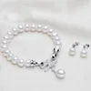 MeiBaPJ Ensemble de bracelet et boucles d'oreilles en perles d'eau douce Bijoux pour femmes Charme de mode Arc Zircon accessoires cadeau d'anniversaire de dame H1022