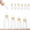 10ml 15ml 20ml 30ml 50ml Garrafa do conta-gotas de vidro fosco frasco de cosméticos vazios para óleo essencial com tampas de bambu imitadas