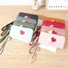 Designer-plånböcker 2021 Små färska Kvinnors handväska i hand Lång mjuk plånbok Kärlek Koreanska studenter Stor kapacitet
