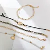 docona Boho Gold Shell Cowrie Anklet Set for Women Black Weaving White Pearl Charms Beaded Anklet Foot Chain Jewelry 8007