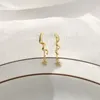long gold teardrop earrings