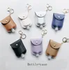 Porte-clés en cuir PU Désinfectant pour les mains Porte-bouteille 30ML Parfum Savon pour les mains Sacs Désinfectant Couvre Cadeau de Noël 7 Couleurs DW5853