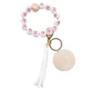 Porte-clés en perles de bois pour femmes, commerce extérieur, motif de noël, mode, personnalité, disque, pompon, bracelet, vente en gros