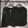 Collection de shorts noirs à entrejambe bas pour hommes à prix réduits 210716