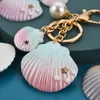 Shell Key Rings Fob Bag Charms Gold Ocean Animal Starfish Llavero Cadenas Soporte para llaves de coche Moda Aleación Artesanía Regalos Colgante Perla de imitación Llavero Accesorios