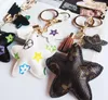 PU läder hänge väska charms söt mode present nyckelring ringhållare blomma hund giraff smycken bil nyckel kedja tillbehör