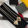 Nytt kärlekshjärta hänge retro halsband som bär läder rep kvinnor lammskinn rep österrikiska kristall metall halsband ccn354
