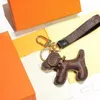 Designers bil keychain favör blomma väska hängsmycke charm smycken nyckelring hållare för män kvinnor gåva mode pus läder djur nyckel kedja tillbehör 3 stil 9Color