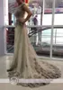 Sexiga Champagne Klänningar Kaftan Dubai Arabiska Bröllopsklänningar Sheer Jewel Neck Cap Sleeves Tulle En Line Bridal Gowns Applique Pärlor