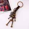 Retro maskin rörlig skruvbult robot nyckelring bronsväska hänger nyckelring hållare punk mode smycken kommer och sandiga