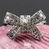 Alyanslar zarif parlak gümüş kaplama beyaz zirkon yüzüğü bowknot tasarım bow için kadın parti mücevher hediye anillos mujer b4m153