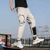 Män corduroy patchwork fickor lastbyxor 2021 harem joggare hajuku sweatpants hip hop streetwear byxor x0723