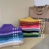 T-shirt feminina Pulloves de jumper de cor sólidos