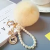 Keychains Faux Fur Ball PomPom Fluffy Pearl Chain Bow Badge Keychain Women Bag Charm Trinket Gold Color Keyring Car Accessory1 Smal22