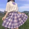 Skolflicka Kvinnors JK Kjolar Japanska Pläterad Uniform Två Styck Klänning Hög Midja A-Line Plaid Kjol Koreansk Preppy Style Sommarbåge Skjorta För Kvinna Full Set