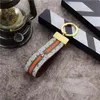 2021 correas de lujo para teléfono móvil llavero de alta calidad soporte de anillo cadena de diseñador de marca Porte Clef regalo bolso de coche para hombre y mujer b005