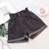 Grande taille taille haute femmes Denim Shorts élastique à volants filles jean court été solide poches doux dame femme bas 210714