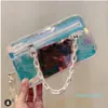 Diseñador de alta calidad para hombres Bolsos cruzados Bolso de PVC con flash láser Bolsos transparentes de arco iris de moda Bolsos de hombro Monedero Bolso de mano pequeño