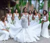 Afrikansk vit spets ihålig sjöjungfru bröllopsklänning plus storlek blommiga applikationer spaghetti straps ärmlös 2021 mode brudklänningar