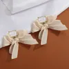 Корейский сладкий черный белый бабочка женские свитки серьги милые ткани кружевные лук моды падение серьги ювелирных изделий подарок 2022
