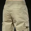 Calça masculina bolso de bolso casual cargo macacão jogador lavado algodão cintura elástica prateleira calça de comprimento esbelto verão fino 2021