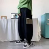Pantaloni da uomo Salopette con tasche grandi per abbigliamento da uomo Pantaloni oversize a gamba larga stile Hong Kong Primavera Autunno Trend Streetwear