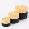 Bottiglie da imballaggio da 100 pezzi Barattoli di vetro smerigliato nero Cosmetico con coperchio in plastica con venature del legno balsamo 5G 10G 15G 20G 30G 50G contenitore cosmetico lucidalabbra