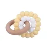 Massaggiagengive ad anello in legno naturale per accessori sanitari per bambini Dita per neonati Giocattoli per esercizi Succhietti in rilievo in silicone colorato Z41397763968