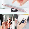 Suporte universal de telefone celular com cola de aderência expansível Suportes de dedo de 360 ​​graus flexíveis para iPhone Samsung