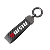 Keychains kolfiberläder Keychain 360 grader roterande hästsko nyckelringar för Nissan Nismo Tiida Teana Skyline Xtrail Qashq8293d