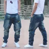 Trendiga Harem Jeans Man Camouflage Patch Pocket Denim Byxor Loose Baggy Cargo Byxor Joggare Byxor Hip Hop Jeans Men Kläder 210622