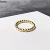 Donia Jewelry Anello di lusso Moda europea e americana Lucido Tondo Perlina Rame Micro-intarsiato Regalo di design con zirconi