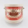 Hop Glänzend Kupfer Hüfte Dental Grills Acht Zähne vergoldet Lange Hosenträger Frauen Männer Party Schmuck Grills Set Großhandel Kostenloser Versand