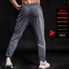 Pantaloni da corsa BINTUOSHI Pantaloni sportivi elastici traspiranti Tasche con cerniera da uomo Pantaloni da allenamento Pantaloni da jogging Pantaloni da fitness per uomo