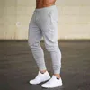 Män joggare märke manliga byxor casual byxor sweatpants jogger grå elastisk bomull gym fitness träning dar xxxl 210715