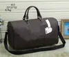 Hoogwaardige 53 cm dames mannen duffle tas bagage bagage duffel grote capaciteit bagage waterdichte handtas casual reizen vintage klassiekers341x