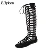 NXY Lady Sandals Eilyke Högkvalitativa Läder Kvinnor Strappy Open Toe Knä Sommar Gladiator Flat Roman Bandage Casual Boots 0126
