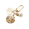 Söt hjärta skal Keychain Creative Small Gifts Ins Metall Smycken Pearl Pendant Ladies Mode Accessoarer Keyfob Nyckelringar