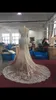 DHL Dubai Arabic Luxury Robes De Mariée Sexy Bling Perlée Dentelle Applique Haute Camp Illusion Manches Longues manches Mermaid Chapelle Robes de mariée
