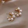 女性のファッションジュエリーの贅沢な結婚式のパーティーの女の子の珍しいイヤリングのためのエレガントな有名人の金属象りの真珠のイヤリング