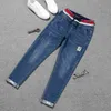 Große Plus Größe 4XL 5XL Frühling Stretch Jeans Frauen High Street Lace Up Harem Hosen Elastische Wasit Patch Manschetten Denim 211115