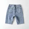 [DEAT] été mode pantalons courts taille haute couleur unie trou irrégulier personnalité femmes Denim Shorts 13C940 210527