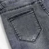 Koreansk mode hög midja denim jeans grå denim elastiska byxor för damer hål knapp kvinnor penna byxor pantalon 11721 210527